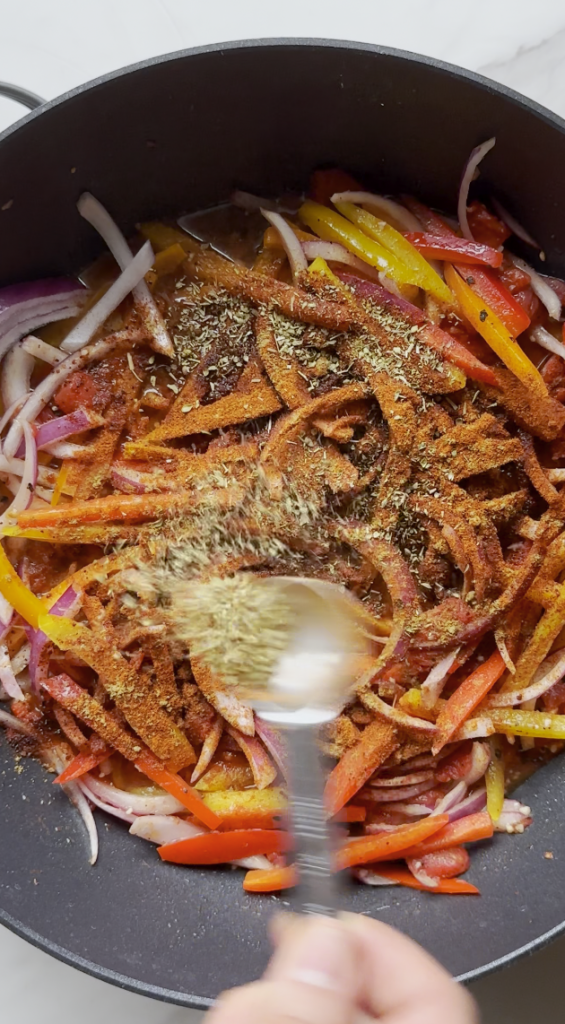 seasonings going into the chicken fajita pasta